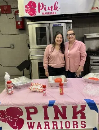 Pink Warriors volunteers preparing meals and support packages